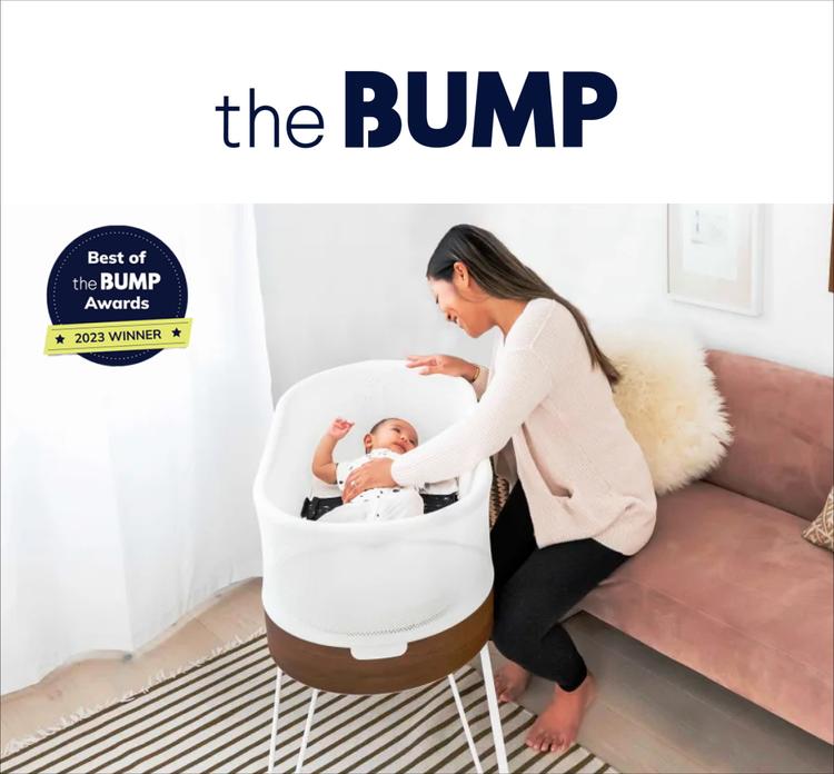 A magazine image of a baby in the SNOO bassinet with a woman beside it