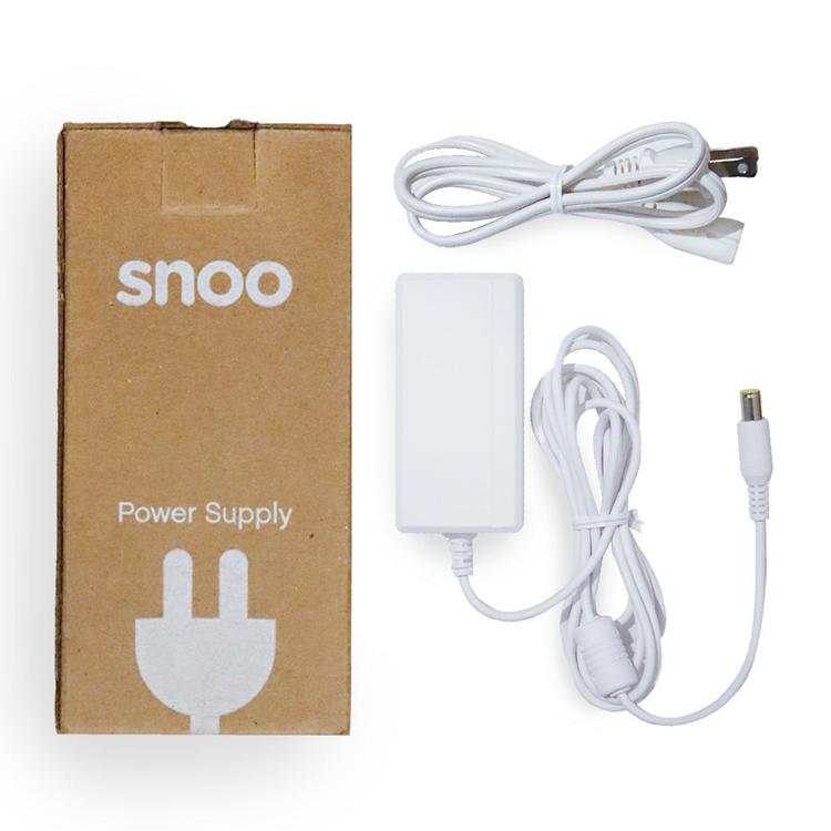 SNOO Power Adapter with the box beside