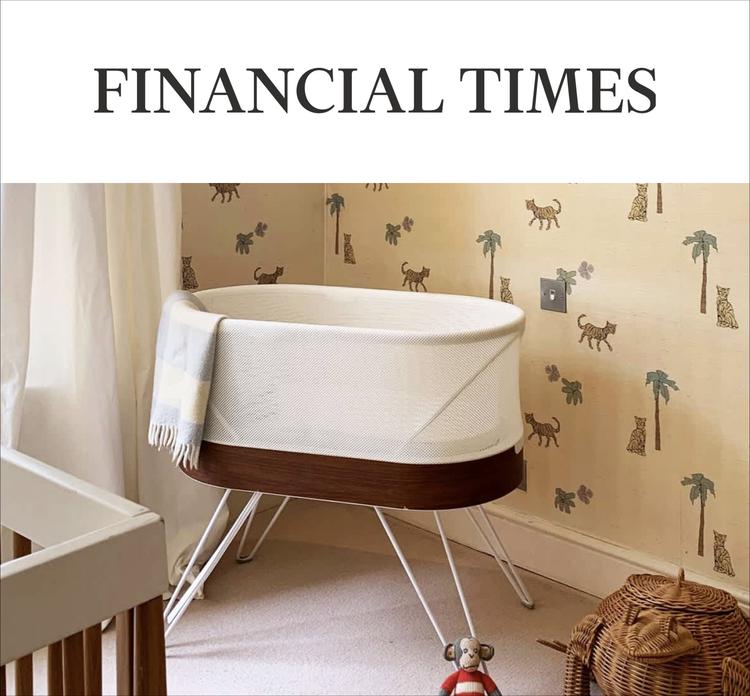 A magazine image featuring the SNOO bassinet in a children's room