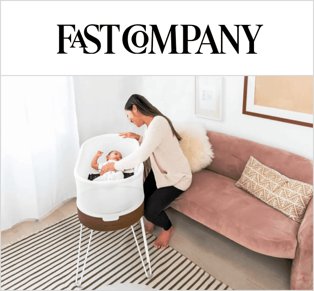 A magazine image featuring the SNOO bassinet with a woman and her baby inside