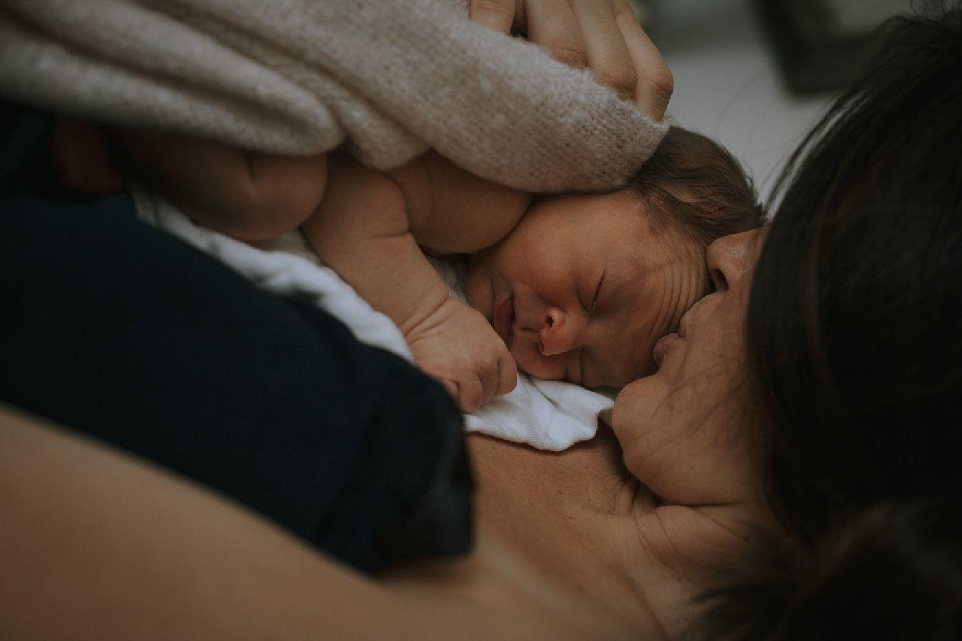 Mother consoles baby during night waking