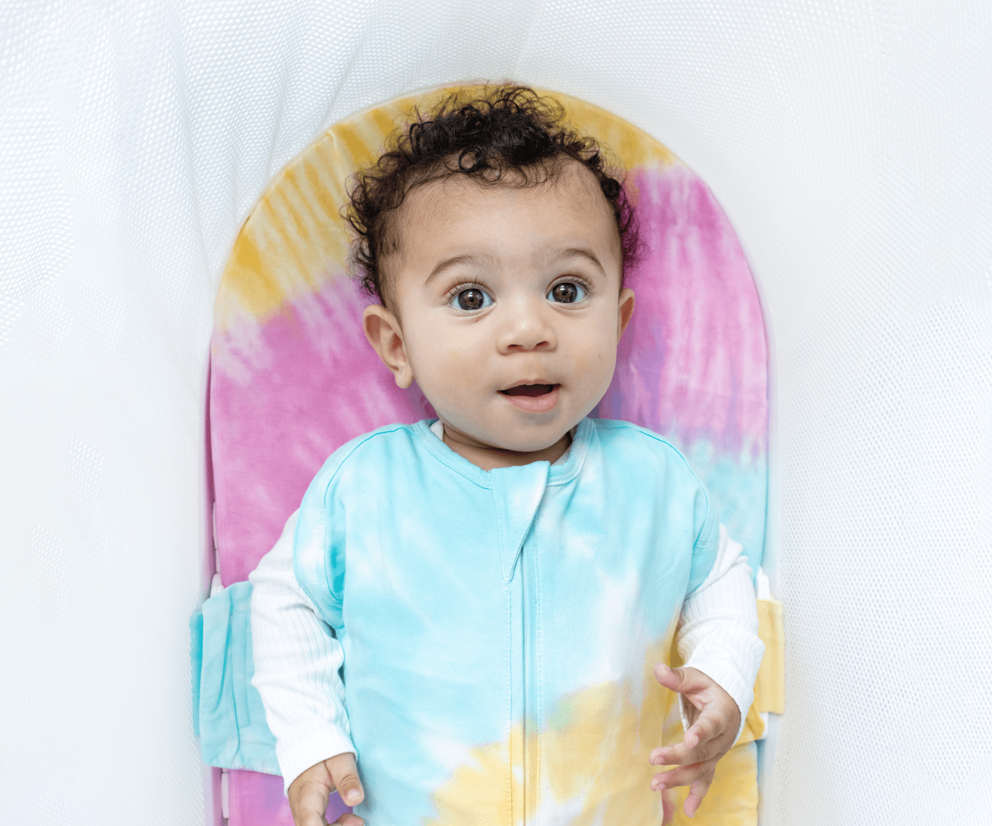 Again, a baby in the SNOO Sleep Sack inside the SNOO bassinet