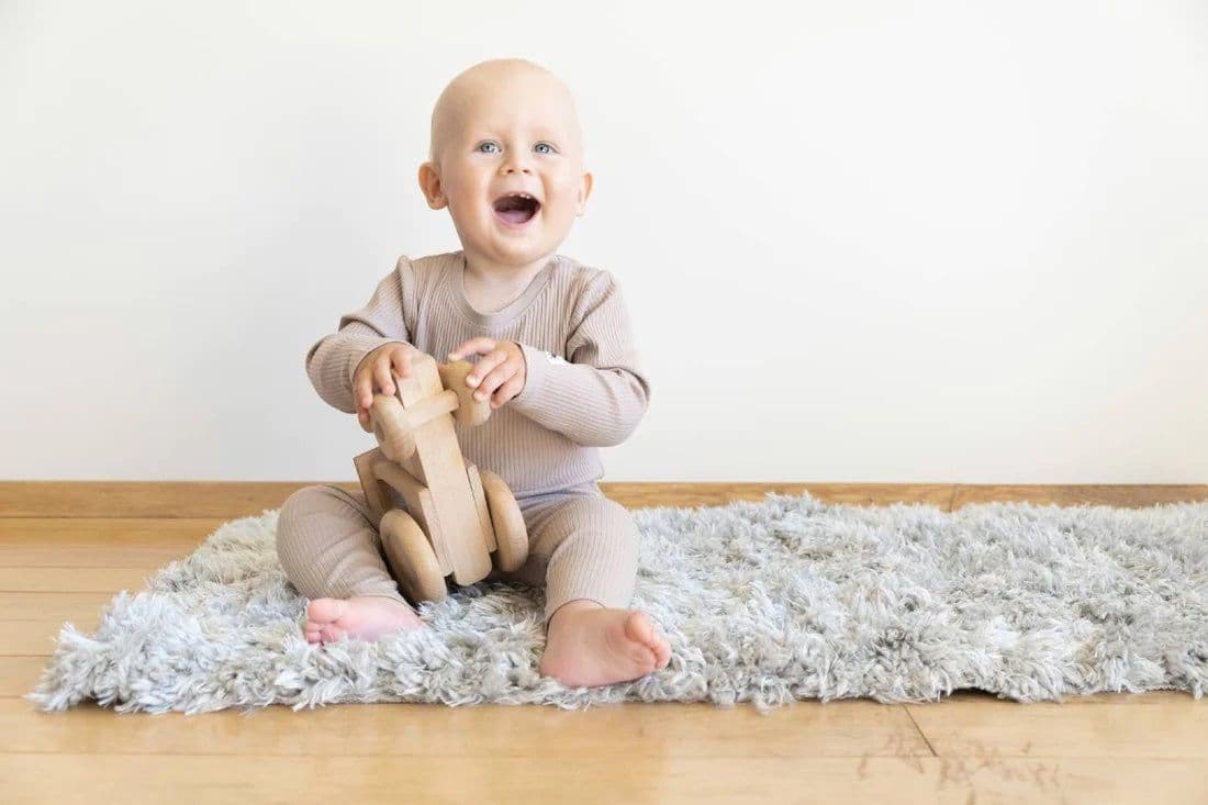 Baby playing with a safe toy