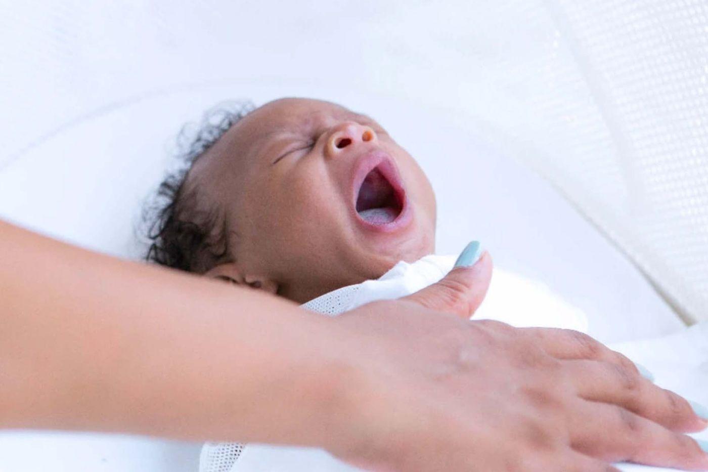 A baby falls asleep in SNOO