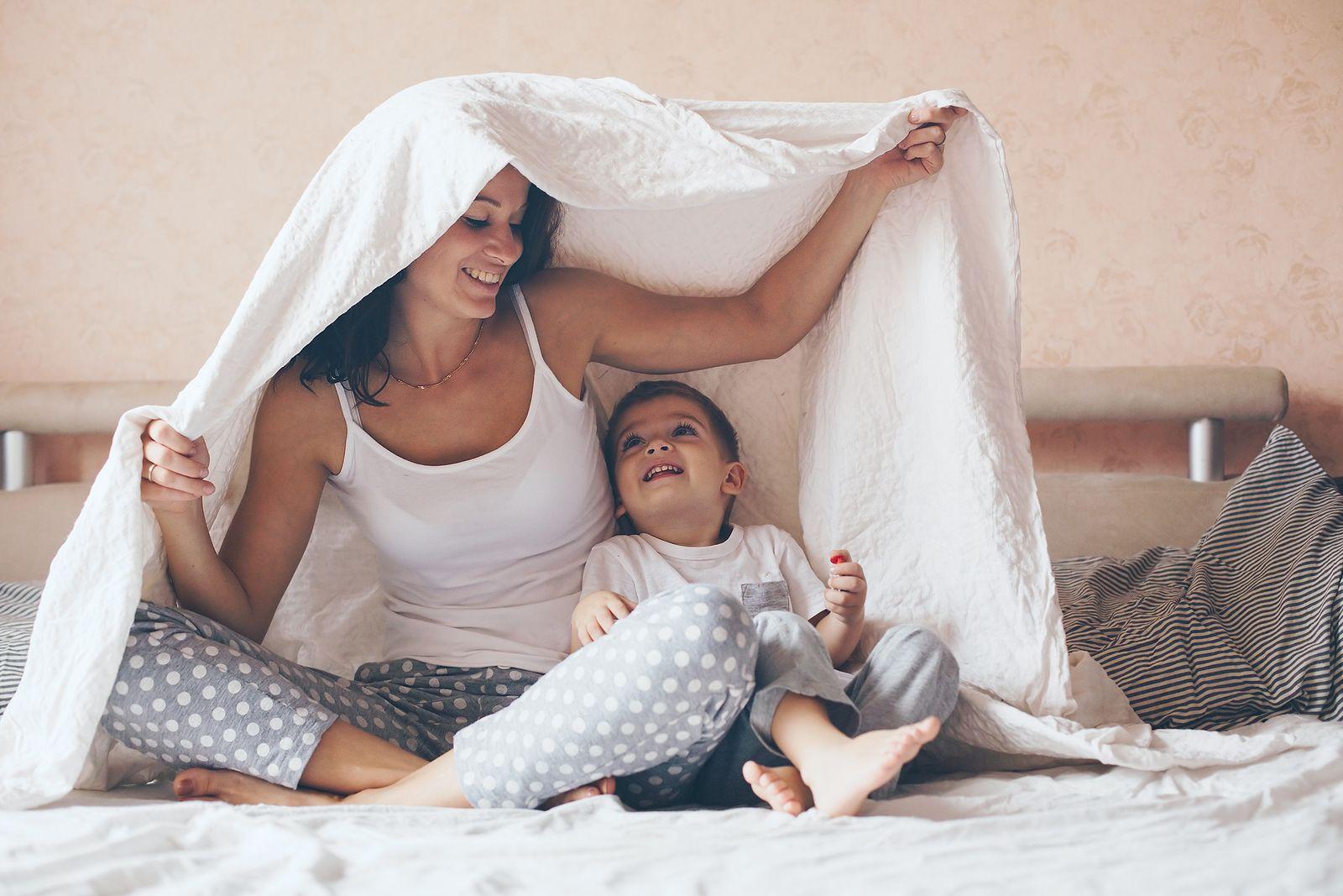 A mother and toddler get ready for bed